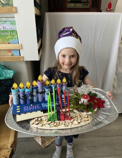 Montessori young girl with candles on tray
