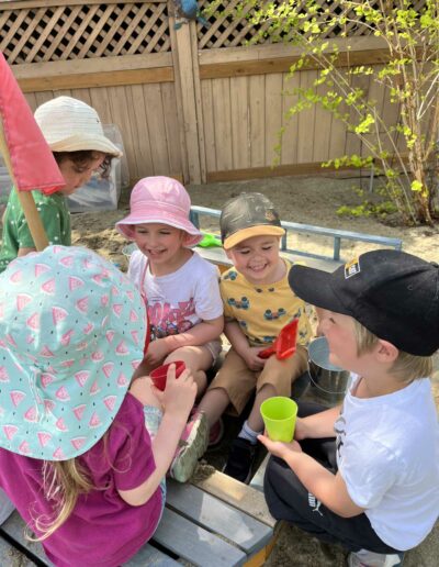 Montessori children in sand box